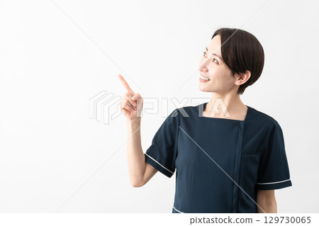 Young woman wearing beauty salon uniform Beauty image 129730065