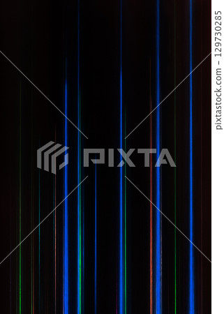 A vertical background image b with many thin rays of light, such as blue, arranged in straight lines on a black background 129730285
