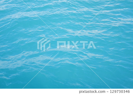 Clear Aqua Ocean Surface with Soft Waves 129730346