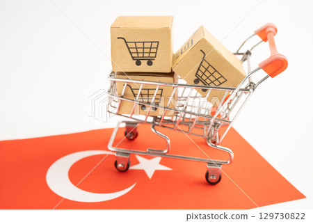 Shopping cart box on Turkey flag, import export, finance commerce. Shopping cart box on Turkey flag, import export, finance commerce. 129730822
