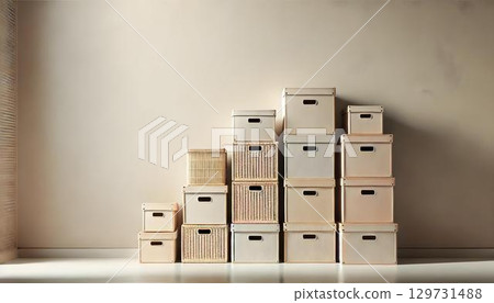 Organized storage boxes beautifully arranged against a soft, neutralcolored wall 129731488