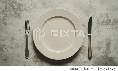Empty Plate with Cutlery 129731736