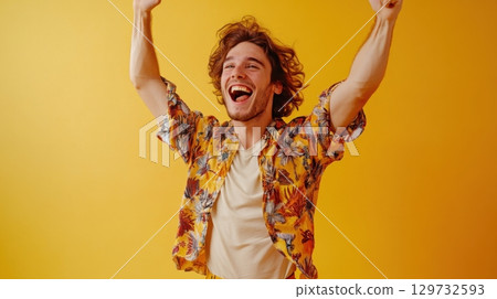 happy man celebrating success with arms raised 129732593