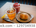 Drinks and bread on a cafe table 129734938