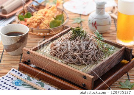 Tempura soba noodles and cold beer. Summer Japanese lunch. Zaru soba noodles with tempura. For advertising, menus, and restaurants. 129735127