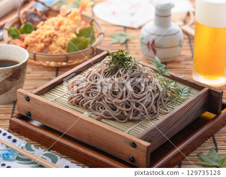 Tempura soba noodles and cold beer. Summer Japanese lunch. Zaru soba noodles with tempura. For advertising, menus, and restaurants. 129735128
