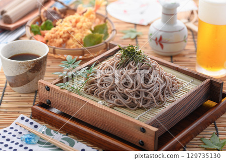 Tempura soba noodles and cold beer. Summer Japanese lunch. Zaru soba noodles with tempura. For advertising, menus, and restaurants. 129735130