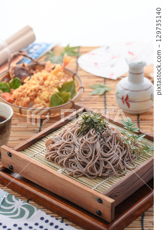 Tempura soba noodles and cold beer. Summer Japanese lunch. Zaru soba noodles with tempura. For advertising, menus, and restaurants. 129735140