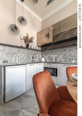 Modern Kitchen Interior with Beige Walls and Decorative Tiles Modern Kitchen Interior with Beige Walls and Decorative Tiles 129735876
