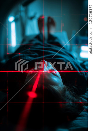 In the Medical Laboratory, Anonymous Female Patient Lying on a CT or MRI Scan Bed Undergoes Scanning Procedure with Red Lasers. Advanced Healthcare Facility with High-Tech Equipment. 129736575