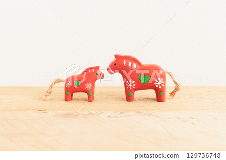 A cute New Year's card for the Year of the Horse, featuring a red horse that brings happiness 129736748