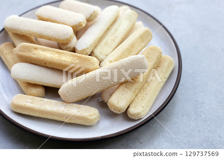 Sponge finger cookies, Italian savoiardi biscuit snack Sponge finger cookies, Italian savoiardi biscuit snack 129737569