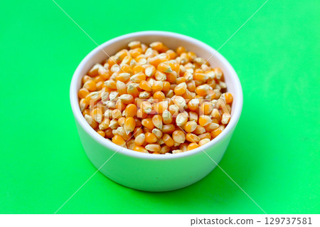 Yellow raw unpopped popcorn kernels Yellow raw unpopped popcorn kernels 129737581
