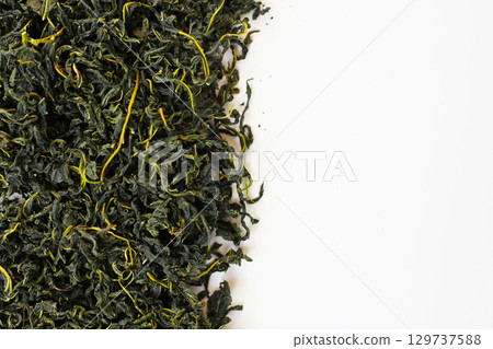 Dried mulberry leaves, commonly used for herbal tea and traditional remedies. Dried mulberry leaves, commonly used for herbal tea and traditional remedies. 129737588