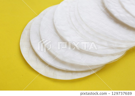 Stacked round sheets of Vietnamese rice paper 129737689