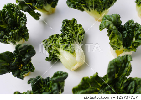 Fresh baby bok choy with crisp white green leaves. Fresh baby bok choy with crisp white green leaves. 129737717