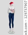 Full-length female mannequin dressed in slim jeans, T-shirt and red bandana on light gray background, front view. 129737907