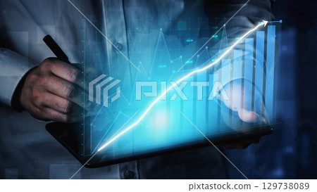 Businessperson Using Tablet to Analyze Financial Data with Graphs and Charts for Growth Strategy Visualization in Modern Office Environment Copula 129738089