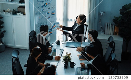 Businessman present idea while investor raise hand to ask question. Directorate. 129738509