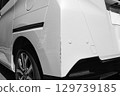 Damaged rear of car, auto repair, scratches 129739185