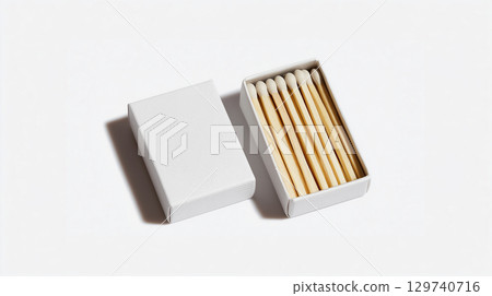 An open box of matches with white tips and a blank cover isolated on a white background 129740716