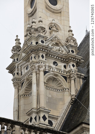 Chambord castle with intricate details in France's Loire Valley during a cloudy day Chambord castle with intricate details in France's Loire Valley during a cloudy day 129740865