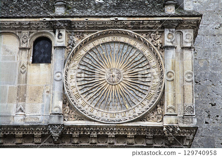 Sun dial sculpture on the exterior of Notre-Dame de Chartres Cathedral in France 129740958