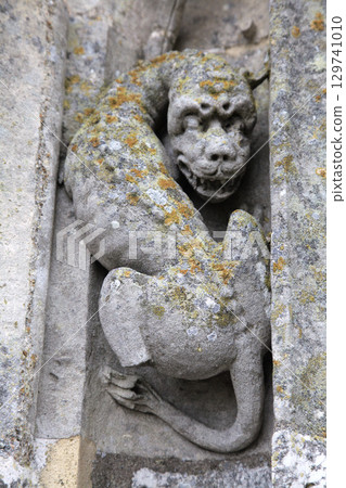 Intricate stone carving of a mythical creature at Notre-Dame de Chartres Cathedral in France Intricate stone carving of a mythical creature at Notre-Dame de Chartres Cathedral in France 129741010