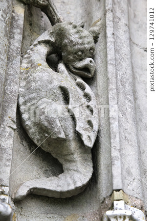Intricate stone carving of a mythical creature at Notre-Dame de Chartres Cathedral in France 129741012