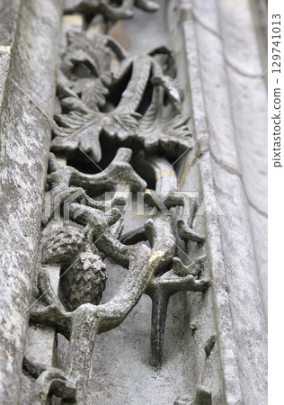 Intricate stone carvings at Notre-Dame de Chartres Cathedral in France showcase historical artistry 129741013