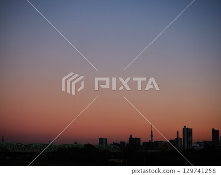 Arakawa Railway Bridge and the silhouette of Skytree at dusk Arakawa Railway Bridge and the silhouette of Skytree at dusk 129741258