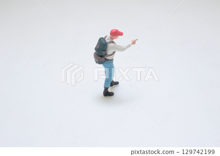Miniature Model Figure of a Hiker Wearing Red Cap and Light Outfit Miniature Model Figure of a Hiker Wearing Red Cap and Light Outfit 129742199