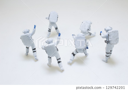 Group of Miniature Astronaut Figures in Space Exploration Suits Group of Miniature Astronaut Figures in Space Exploration Suits 129742201
