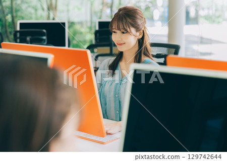 Young woman working in the office Young woman working in the office 129742644