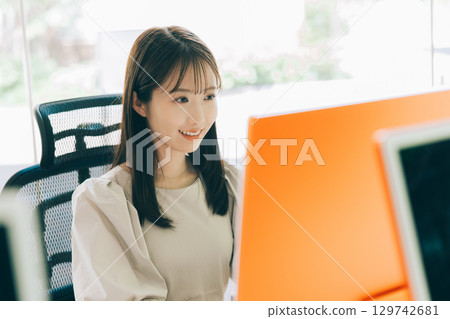 Young woman working in the office 129742681