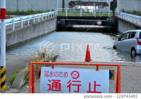 Underpass road flooded and closed due to heavy rain 129743405