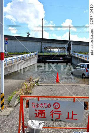 Underpass road flooded and closed due to heavy rain 129743410