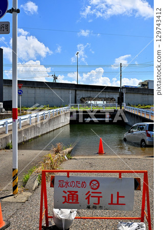 Underpass road flooded and closed due to heavy rain 129743412