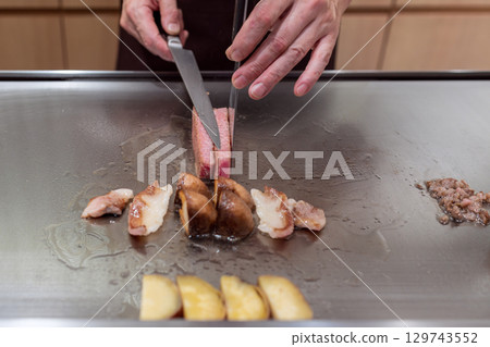 Teppanyaki Kobe beef with mushrooms and vegetables hot plate Teppanyaki Kobe beef with mushrooms and vegetables hot plate 129743552