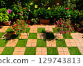 The roof balcony is covered with tiles and artificial grass, creating a wonderful space. Many plants are grown and flowers bloom every day. 129743813