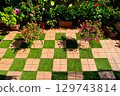 The roof balcony is covered with tiles and artificial grass, creating a luxurious space. Many plants are grown and flowers bloom every day. 129743814