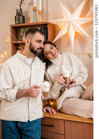Cozy Couple Enjoying Hot Chocolate Together Cozy Couple Enjoying Hot Chocolate Together 129745865