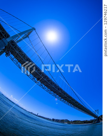 Wide-angle view of the Kanmon Bridge under a midsummer blue sky (August) Wide-angle view of the Kanmon Bridge under a midsummer blue sky (August) 129746217