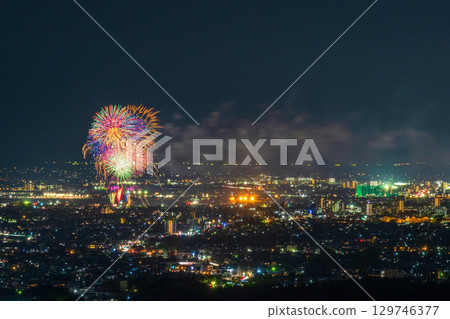 A summer tradition: Fireworks display. Night view of Kumamoto city and the Gozu Lake fireworks display seen from the Aso District viewpoint. A summer tradition: Fireworks display. Night view of Kumamoto city and the Gozu Lake fireworks display seen from the Aso District viewpoint. 129746377