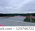 The early Spring view of the pedestrian bridge leading to Neman River beach and the biggest park in Kaunas city (Lithuania). 129746722