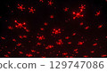 Red drone swarm flying in dark night sky with glowing lights creating futuristic scene 129747086