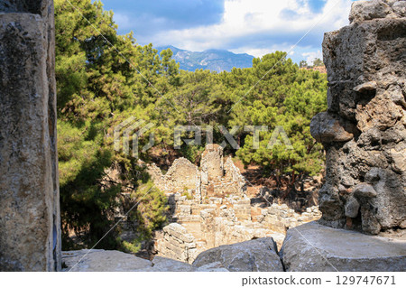 Ancient ruins of Phaselis City in Turkey framed by trees and mountains Ancient ruins of Phaselis City in Turkey framed by trees and mountains 129747671
