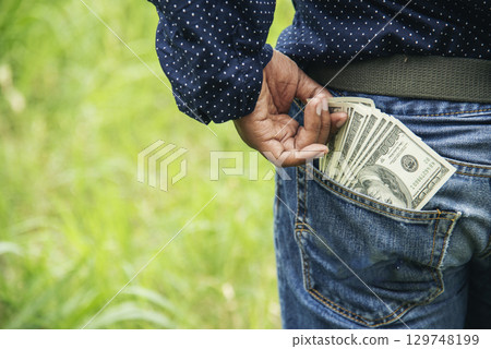 Hand holding loan money dollar bank note give financial payment. Man hands showing spread 100 dollar exchange cash payout. Saving Businessman counting money banknote bribe corruption concept. Hand holding loan money dollar bank note give financial payment. Man hands showing spread 100 dollar exchange cash payout. Saving Businessman counting money banknote bribe corruption concept. 129748199