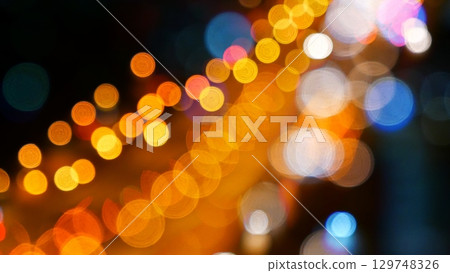 Blurred background night city bokeh car drive on road in nightlife. Light line traffic jam in black night. Blur street flare traffic motion movement. Cityscape Urban dark background twilight time Blurred background night city bokeh car drive on road in nightlife. Light line traffic jam in black night. Blur street flare traffic motion movement. Cityscape Urban dark background twilight time 129748326