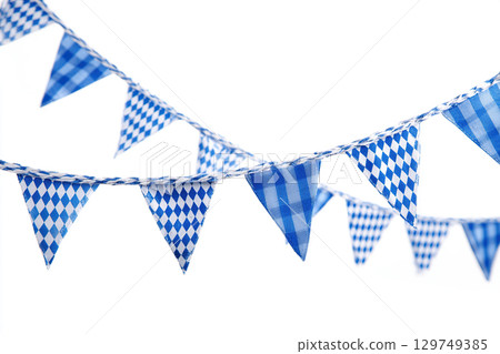 Original Bavarian garland with a diamond pattern in blue and white. Classic decoration for a beer tent at the Oktoberfest festival. 129749385